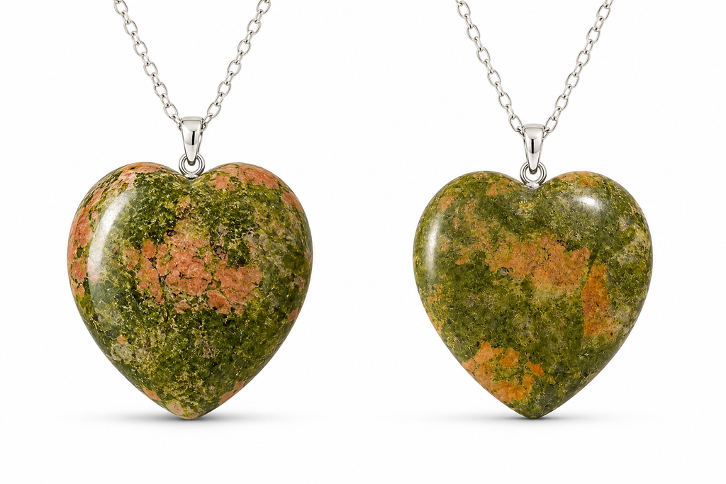 Two heart-shaped gemstone pendants on silver chains, displayed side by side against a white background. The pendants feature a marbled pattern of green, orange, and brown.