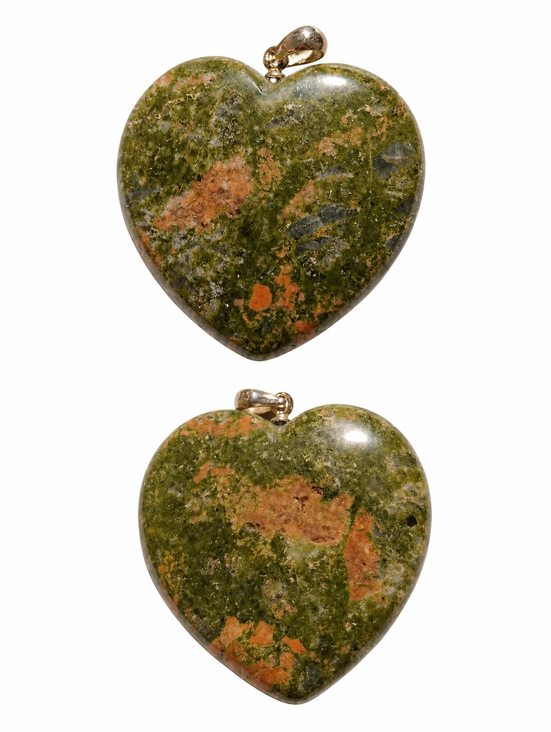 Two heart-shaped polished stone pendants with gold-tone loops, displayed vertically on a plain white background. The stones have a mottled pattern of olive green, orange, and brown.